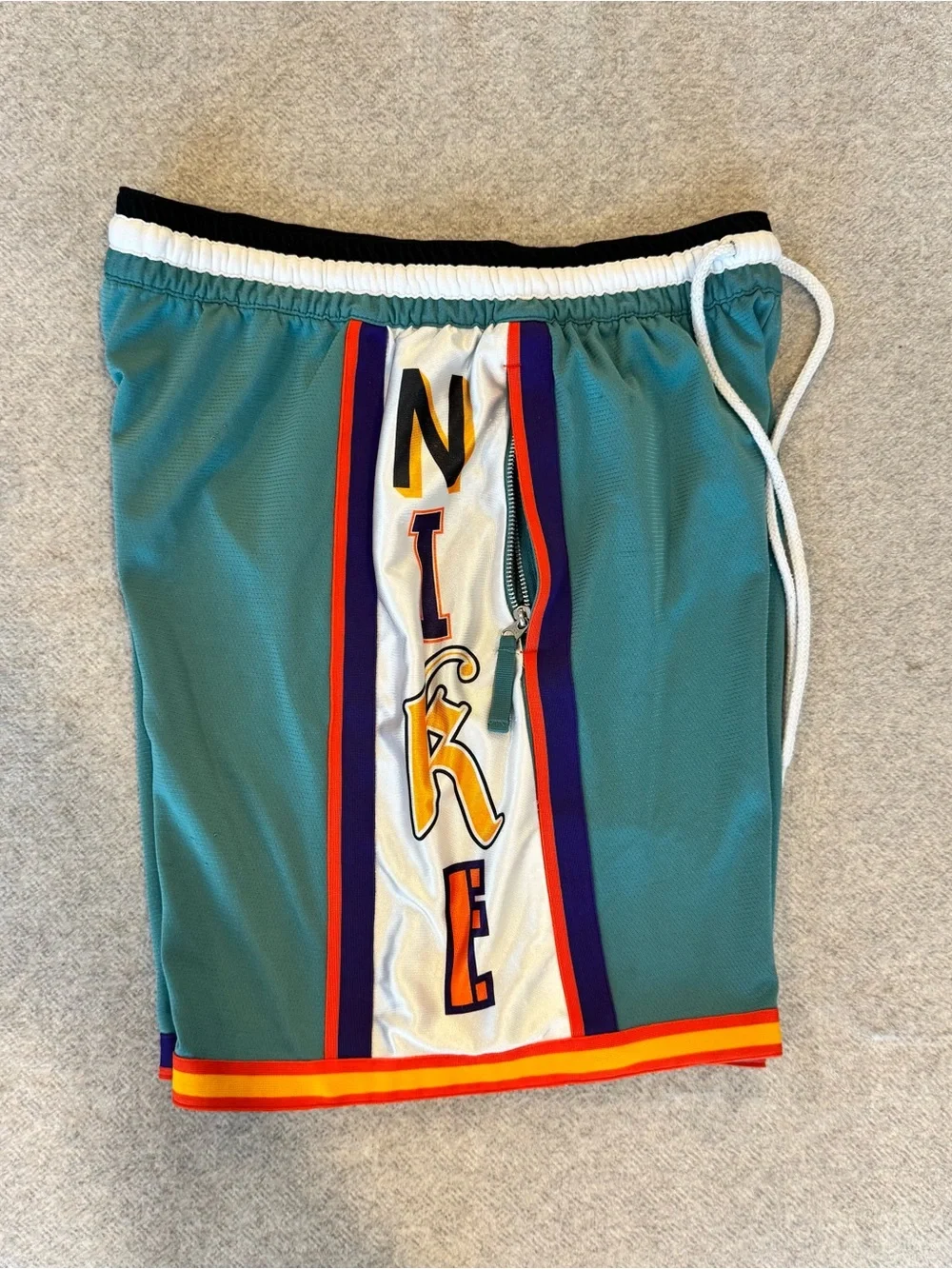 Nike Teal Basketball Shorts with Multicolor Side Panels